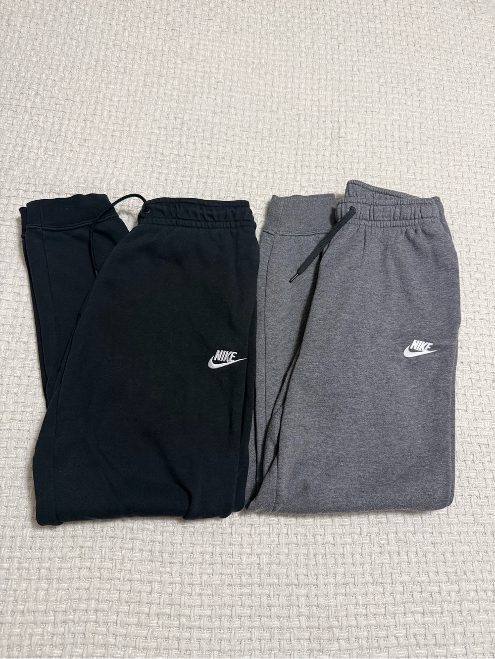 Nike small joggers.  Set of two. Black and grey.